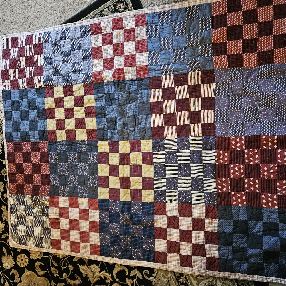 Handmade Quilt with Red, Blue, and Yellow Squares